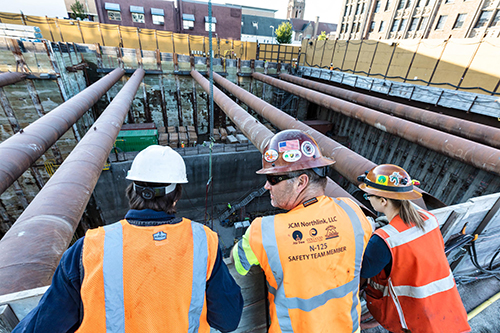 construction crew looking over a site