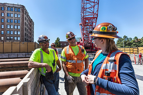 construction crew in vests on site